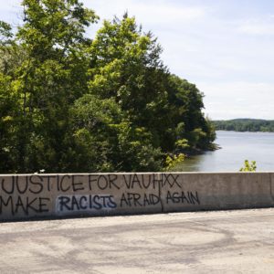 BLOOMINGTON, INDIANA, UNITED STATES - 2020/07/14: Graffiti saying Justice for Vauhxx, Make racists afraid again seen on the causeway near the McCord property where Vauhxx Booker was assaulted on the 4th of July at Monroe Lake.The Indiana Department of Natural Resources released its investigation into a July 4th incident and recommended charges against several, including Booker. Booker, who is Black, says he was the victim of an attempted lynching. (Photo by Jeremy Hogan/SOPA Images/LightRocket via Getty Images)
