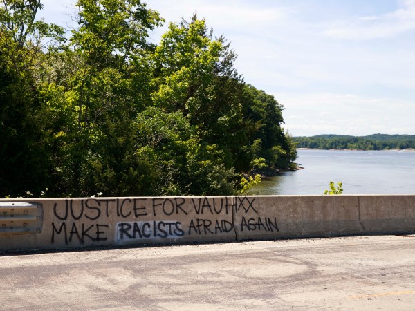 BLOOMINGTON, INDIANA, UNITED STATES - 2020/07/14: Graffiti saying Justice for Vauhxx, Make racists afraid again seen on the causeway near the McCord property where Vauhxx Booker was assaulted on the 4th of July at Monroe Lake.The Indiana Department of Natural Resources released its investigation into a July 4th incident and recommended charges against several, including Booker. Booker, who is Black, says he was the victim of an attempted lynching. (Photo by Jeremy Hogan/SOPA Images/LightRocket via Getty Images)