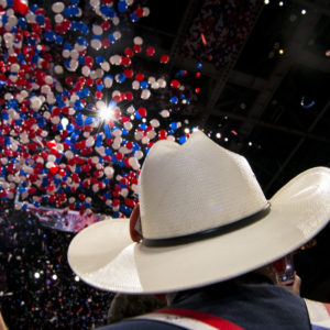 CLEVELAND, OHIO - JULY 21: Texas GOP delegates look to the ceiling of the Quicken Loans arena as balloons drop on the last day of the Republican National Convention on July 21, 2016 in Cleveland, Ohio. Photo by Ann Hermes/The Christian Science Monitor