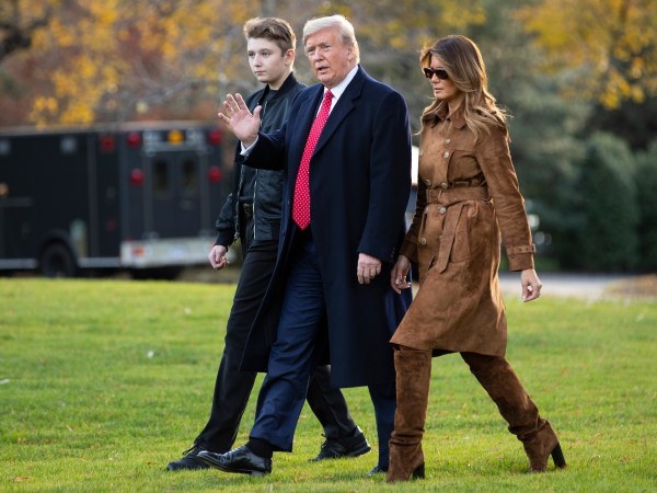 President Donald, first lady Melania Trump, and Barron Trump, walk to board Marine One on the South Lawn of the White House, Tuesday, Nov. 26, 2019, in Washington.  (AP Photo/ Evan Vucci)