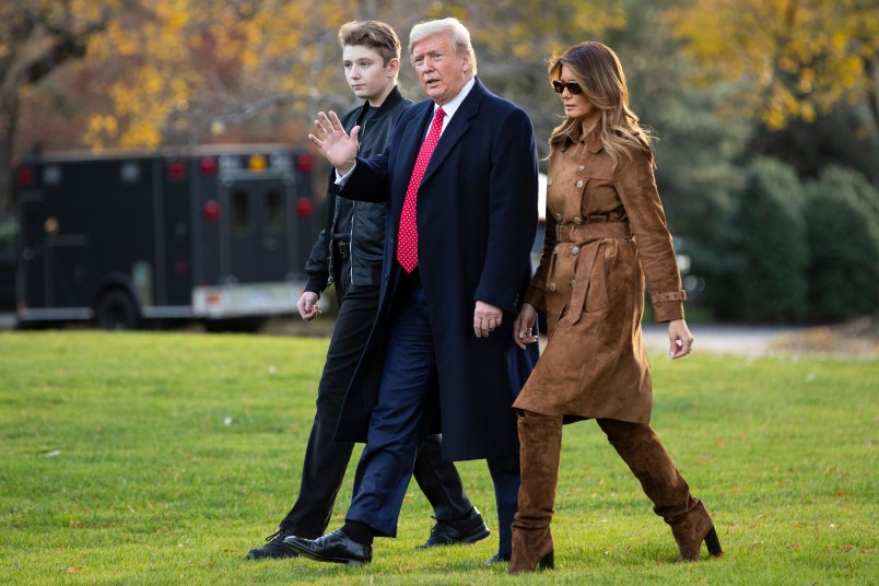 President Donald, first lady Melania Trump, and Barron Trump, walk to board Marine One on the South Lawn of the White House, Tuesday, Nov. 26, 2019, in Washington.  (AP Photo/ Evan Vucci)
