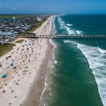 Beachgoers pack Wrightsville Beach Sunday, Aug. 2, 2020 as Tropical Storm Isaias moves along the Southeast Coast.