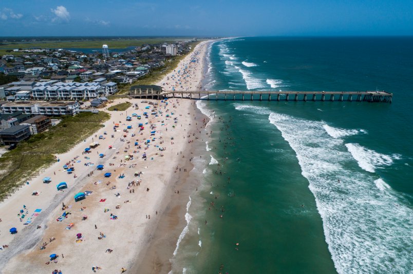 Beachgoers pack Wrightsville Beach Sunday, Aug. 2, 2020 as Tropical Storm Isaias moves along the Southeast Coast.