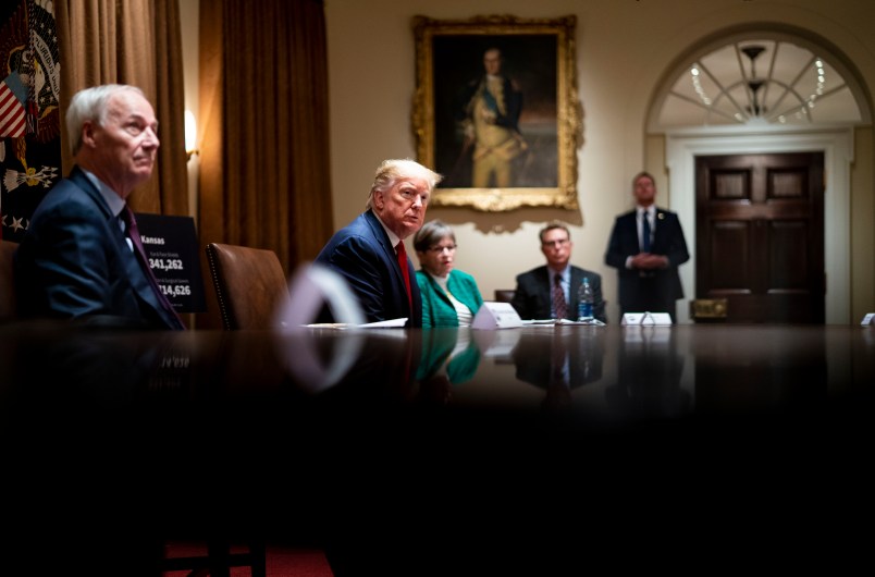 NYTVIRUS -  President Donald Trump makes remarks as he attends a meeting with the Arkansas Governor Asa Hutchinson and Kansas Governor Laura Kelly in the Cabinet Room of the White House, Wednesday, May 20, 2020.  ( Photo by Doug Mills/The New York Times)