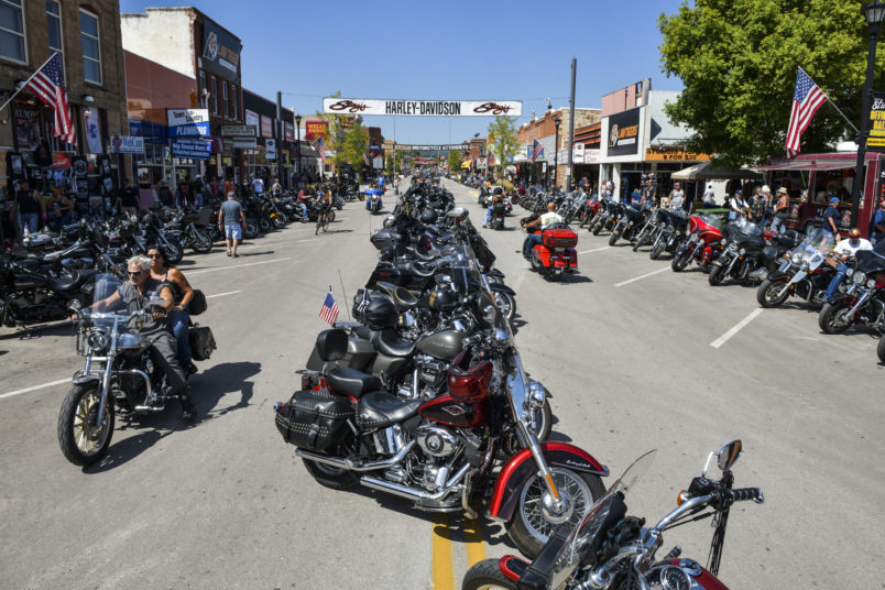 STURGIS, SD - AUGUST 07: Motorcyclists ride down Main Street during the 80th Annual Sturgis Motorcycle Rally on August 7, 2020 in Sturgis, South Dakota. While the rally usually attracts around 500,000 people, officials estimate that more than 250,000 people may still show up to this year's festival despite the coronavirus pandemic. (Photo by Michael Ciaglo/Getty Images)