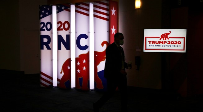 NYTRNC20An RNC sign glows outside the Charlotte Convention Center’s Richardson Ballroom in Charlotte, NC where delegates gather for the roll call vote to renominate Donald J. Trump to be President of the United States and Mike Pence to be Vice President.(Travis Dove for The New York Times)