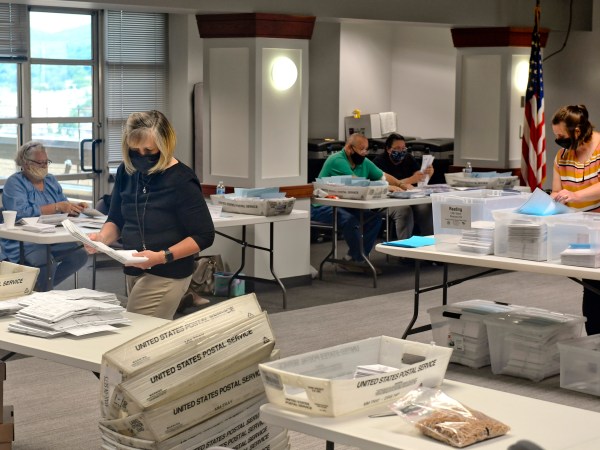 On the 13ths floor of the Berks County Services Center in the Commissioners boardroom in Reading Wednesday afternoon June 3, 2020 where workers were opening and county the mail-in and absentee ballots from Tuesday's election. Workers were wearing masks as a precaution against the spread of coronavirus.