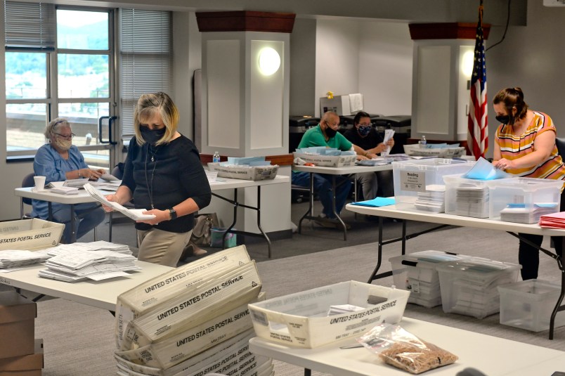On the 13ths floor of the Berks County Services Center in the Commissioners boardroom in Reading Wednesday afternoon June 3, 2020 where workers were opening and county the mail-in and absentee ballots from Tuesday's election. Workers were wearing masks as a precaution against the spread of coronavirus.