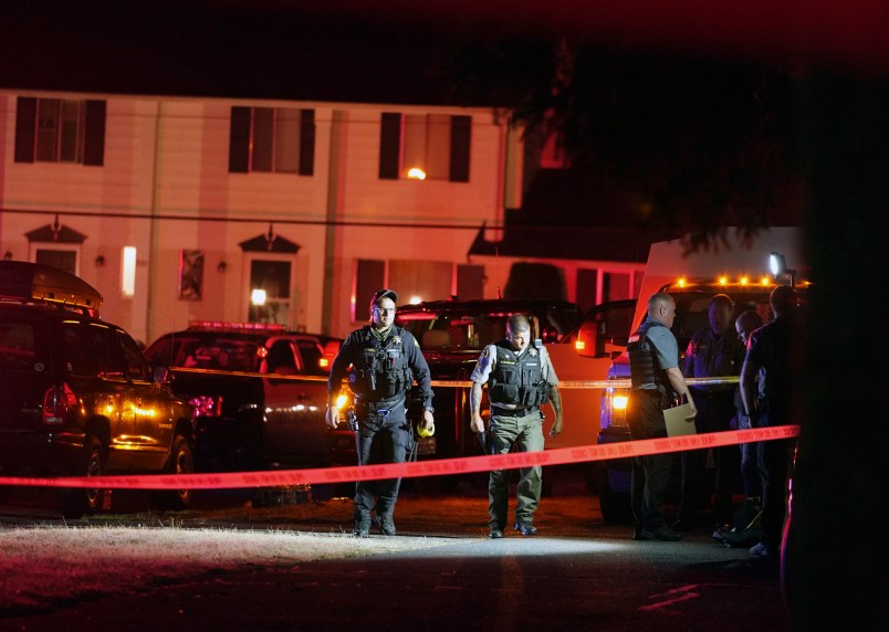 Police officials work at a scene where a man suspected of fatally shooting a supporter of a right-wing group in Portland, Oregon, last week was killed as investigators moved in to arrest him in Lacey, Wash., on Thursday, Sept. 3, 2020. (AP Photo/Ted Warren)