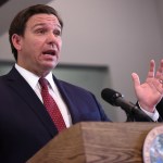 APOPKA, FLORIDA, UNITED STATES - 2020/07/17: Florida Governor Ron DeSantis speaks during a press conference at Wellington Park Apartments to announce the release of $75 million in funding from the CARES Act for local governments to provide rental and mortgage assistance to Floridians suffering financial difficulties due to the COVID-19 pandemic.DeSantis has refused calls to impose a statewide face mask mandate despite record numbers of coronavirus cases and deaths in the state in recent days. DeSantis has refused calls to impose a statewide face mask mandate despite record numbers of coronavirus cases and deaths in the state in recent days. (Photo by Paul Hennessy/SOPA Images/LightRocket via Getty Images)