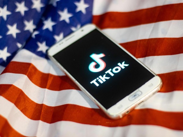 TikTok closeup logo displayed on a phone screen, smartphone on the American flag or U.S. flag, the national flag of the United States are seen in this multiple exposure illustration. Tik Tok is a Chinese video-sharing social networking service owned by a Beijing based internet technology company, ByteDance.  It is used to create short dance, lip-sync, comedy and talent videos. ByteDance launched TikTok app for iOS and Android in 2017 and earlier in September 2016 Douyin fror the market in China. TikTok became the most downloaded app in the US in October 2018. President of the USA Donald Trump is threatening and planning to ban the popular video sharing app TikTok from the US because of the security risk.  On August 3, 2020 in Thessaloniki, Greece.(Photo by Nicolas Economou/NurPhoto)