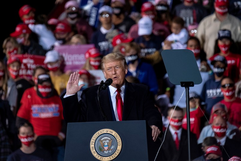 SWANTON, OH - SEPTEMBER 21: President Donald Trump charges up the crowd while speaking of the need to win the upcoming election during a campaign rally at the Toledo Express Airport on September 21, 2020 in Swanton, Ohio. (Photo by Matthew Hatcher/Getty Images)