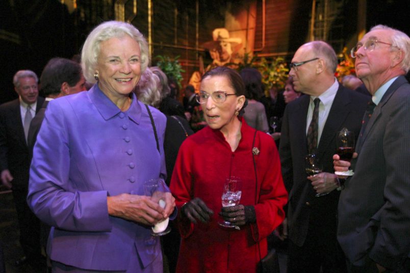WASHINGTON, DC - OCTOBER 27: A surprise birthday party was held for Michael Kaiser, president of the Kennedy Center, on the stage of the Opera House. Supreme Court Justices Sandra Day O'Connor and Ruth Bader Ginsburg talk as their husbands look at the surroundings to right. (Photo by Susan Biddle/The Washington Post)