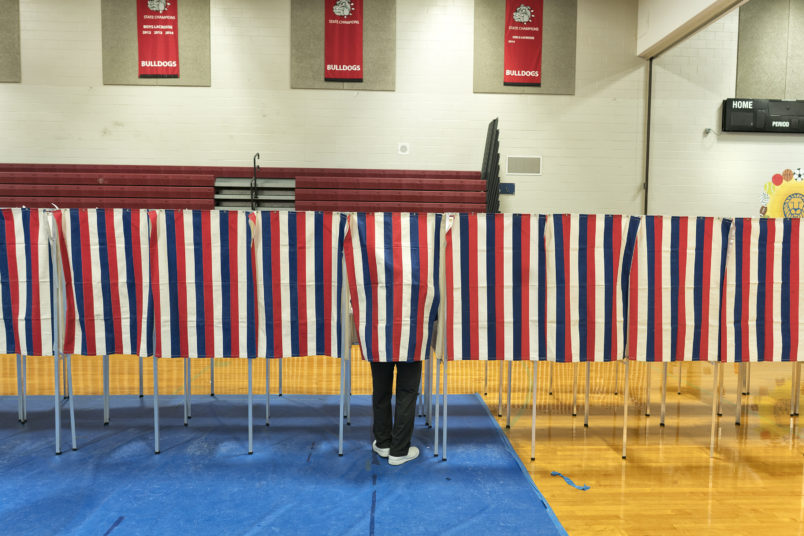 BEDFORD, NH - FEBRUARY 9: Voters head to the polling booths inside the Bedford High school, February 9, 2016 in Bedford, New Hampshire. (Photos by Charles Ommanney/The Washington Post)