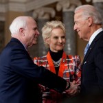 Sen. John McCain (R-AZ) participates in a reenactment of her swearing in ceremony with Vice President Joe Biden, inside the Old Senate Chamber on Capitol Hill in Washington, DC.  On the right is his wife Cindy.