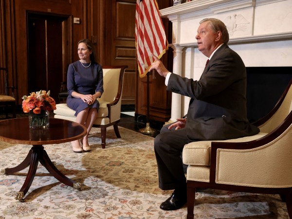 WASHINGTON, DC - SEPTEMBER 29: Seventh U.S. Circuit Court Judge Amy Coney Barrett, President Donald Trump's nominee for the U.S. Supreme Court, listens as Senate Judiciary Committee Chairman Lindsey Graham (R-SC) answers reporters' questions before a meeting in the Mansfield Room at the U.S. Capitol September 29, 2020 in Washington, DC. Barrett is meeting with senators ahead of her confirmation hearing which is scheduled to begin on October 12, less than a month before Election Day. (Photo by Chip Somodevilla/Getty Images)