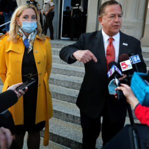 "The government choses to persecute us for doing no more than exercising our right to defend ourselves, our home, our property and our family,” says Mark McCloskey, addressing the press alongside his wife Patricia on Tuesday, Oct. 6, 2020, outside the Carnahan Courthouse. Their hearing scheduled for today was postponed until next week. The McCloskeys were charged in July with brandishing guns at protesters outside their Portland Place mansion in June. Photo by Laurie Skrivan, lskrivan@post-dispatch.com