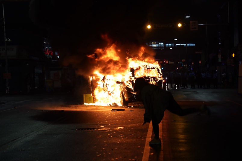 A police car set on fire during a protest in response to the police shooting of Walter Wallace Jr. on Monday, October 26, 2020 in Philadelphia, Pa. Police officers fatally shot the 27-year-old Black man during a confrontation Monday afternoon in West Philadelphia that quickly raised tensions in the neighborhood. Shortly before 4 p.m., two officers fired their guns at the man in the 6100 block of Locust Street. Police then transported the man to Penn Presbyterian Medical Center. He was later pronounced dead at the hospital. JESSICA GRIFFIN / The Philadelphia Inquirer