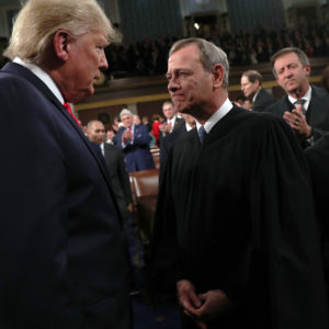 U.S. President Donald Trump talks to  Supreme Court Chief Justice John Roberts while Associate Justice Elena Kagan looks on as the president arrives to U.S. President Donald Trump delivers his State of the Union address to a joint session of the U.S. Congress in the House Chamber of the U.S. Capitol in Washington, U.S., February 3, 2020. REUTERS/Leah Millis/POOL