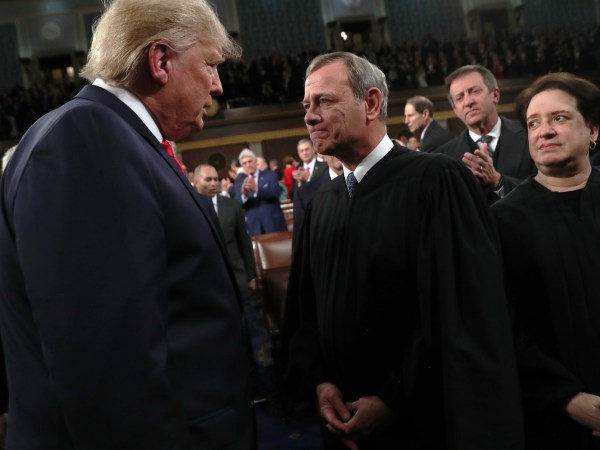 U.S. President Donald Trump talks to  Supreme Court Chief Justice John Roberts while Associate Justice Elena Kagan looks on as the president arrives to U.S. President Donald Trump delivers his State of the Union address to a joint session of the U.S. Congress in the House Chamber of the U.S. Capitol in Washington, U.S., February 3, 2020. REUTERS/Leah Millis/POOL