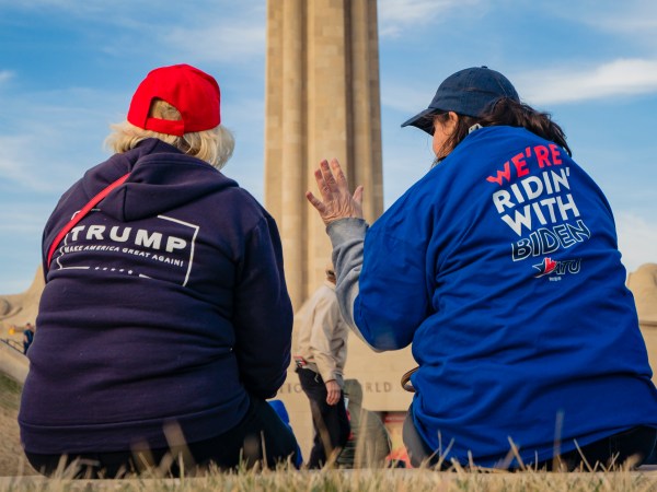 KANSAS CITY, MO - MARCH 07: A President Donald Trump and a former Vice President Joe Biden supporter converse before the Joe Biden Campaign Rally at the National World War I Museum and Memorial on March 7, 2020 in Kansas City, Missouri. (Photo by Kyle Rivas/Getty Images)