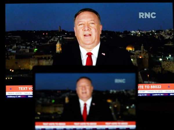 WASHINGTON, Aug. 26, 2020 -- Photo taken on Aug. 25, 2020 shows screens displaying U.S. Secretary of State Mike Pompeo giving a speech to the Republican National Convention (RNC) from Jerusalem. U.S. House Democrat Joaquin Castro on Tuesday announced that he had launched an investigation into Secretary of State Mike Pompeo's speech to the RNC on Tuesday night. (photo by Liu Jie/Xinhua via Getty)