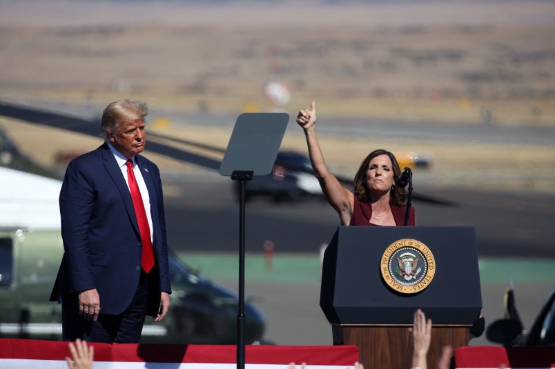 PRESCOTT, AZ - OCTOBER 19: U.S. President Donald Trump watches as Senator Martha McSally (R-AZ) speaks at a “Make America Great Again” campaign rally on October 19, 2020 in Prescott, Arizona. With almost two weeks to go before the November election, President Trump is back on the campaign trail with multiple daily events as he continues to campaign against Democratic presidential nominee Joe Biden. (Photo by Caitlin O'Hara/Getty Images)