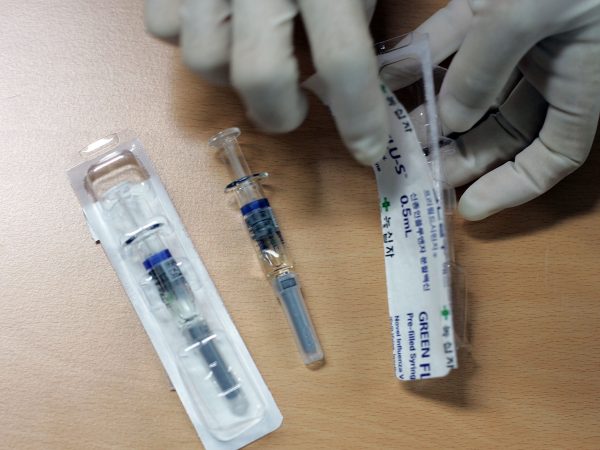 A man receives a H1N1 swine flu vaccine at XXXXX on October 27, 2009 in Seoul, South Korea. The Korea Food and Drug Administration approved domestically developped vaccines last week, the government plan to vaccinate 35 percent of South Korean population until next February.