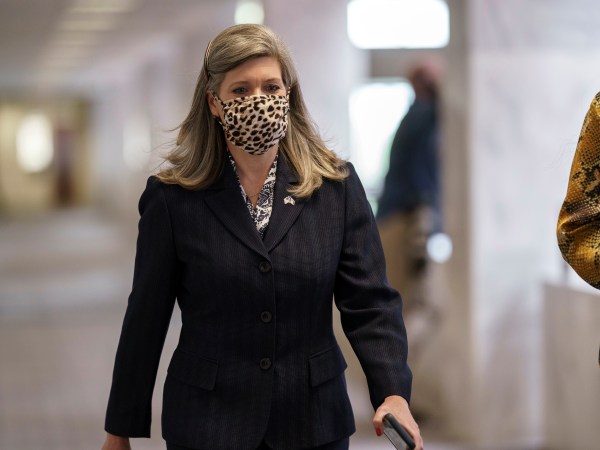 Sen. Joni Ernst, R-Iowa, arrives for a meeting with Senate Majority Leader Mitch McConnell, R-Ky., and fellow Republicans as they work toward the confirmation of Judge Amy Coney Barrett to the Supreme Court, at the Capitol in Washington, Monday, Oct. 26, 2020. The addition of Judge Barrett to the court would give conservatives six of the court’s nine seats. (AP Photo/J. Scott Applewhite)