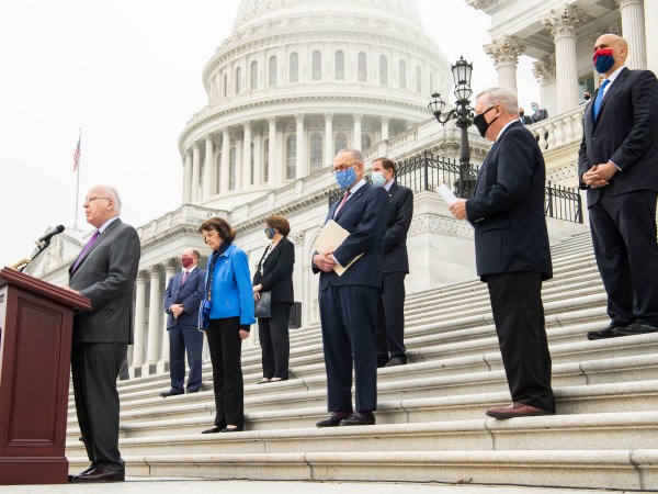 UNITED STATES - OCTOBER 22: From left, Sens. Patrick Leahy, D-Vt., Chris Coons, D-Del., Senate Judiciary Committee ranking member Dianne Feinstein, D-Calif., Sen. Amy Klobuchar, D-Minn., Senate Minority Leader Charles Schumer, D-N.Y., Sens. Richard Blumenthal, D-Conn., Richard Durbin, D-Ill., and Cory Booker, D-N.J., attend a news conference on the Senate steps of the Capitol with Democratic members of the Senate Judiciary Committee after they boycotted the markup of Supreme Court justice nominee Judge Amy Coney Barrett, on Thursday, October 22, 2020. (Photo By Tom Williams/CQ Roll Call)