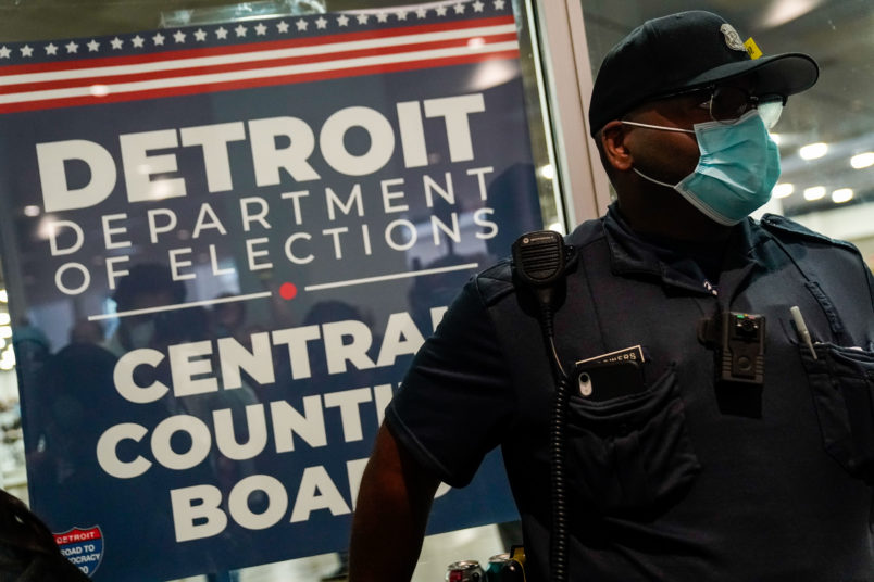 DETROIT, MI - NOVEMBER 04: A police officer stands at the entrance to the Detroit Department of Elections Central Counting Board of Voting absentee ballot counting center at TCF Center, Wednesday, Nov. 4, 2020 in Detroit, MI. With the surge in vote by mail/absentee ballots, analysts cautioned it could take days to count all the ballots, leading some states to initially look like victories for President Trump only to later shift towards democratic Presidential candidate Joe Biden.