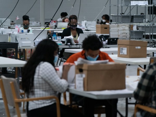 LAWRENCEVILLE, GA - NOVEMBER 07: Election personnel sort ballots in preparation for an audit at the Gwinnett County Board of Voter Registrations and Elections offices on November 7, 2020 in Lawrenceville, Georgia. (Photo by Elijah Nouvelage/Getty Images)