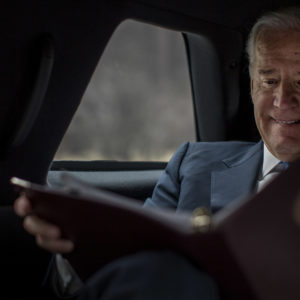 ROCKVILLE, MD - MARCH 13:  Reading briefing materials during a planning meeting with staff, Vice President Joe Biden is driven back to the White House after speaking to lawmakers, woman against violence advocates, and constituents concerning reducing  domestic violence homicides in Rockville, Maryland, on Wednesday, March 13, 2013. (Photo by Melina Mara/The Washington Post)