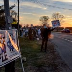 Protesters line Prairieton Road across from the Federal Death Chamber in Terre Haute, IN. during a protest against the execution of Brandon Bernard on Thursday evening. (Austen Leake/Tribune-Star via AP)