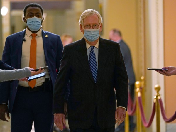Senate Majority Leader Mitch McConnell of Ky., walks past reporters on Capitol Hill in Washington, Tuesday, Dec. 15, 2020. (AP Photo/Susan Walsh)