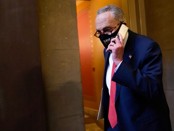 Senate Minority Leader Sen. Chuck Schumer of N.Y., walks on Capitol Hill in Washington, Tuesday, Dec. 15, 2020. (AP Photo/Susan Walsh)
