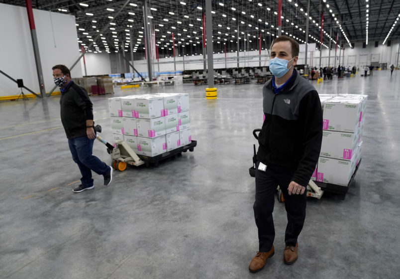 Boxes containing the Moderna COVID-19 vaccine are prepared to be shipped at the McKesson distribution center in Olive Branch, Miss., Sunday, Dec. 20. (AP Photo/Paul Sancya, Pool)