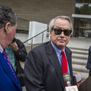 LOS ANGELES, CA - DECEMBER 03: British diver Vernon Unsworth; L, watches his attorneys; Mark Stephen; R, and L. Lin Wood; C, speaks to members of the media while they arrive at US District Court, Central District of California in Los Angeles, U.S. on December 3, 2019 in Los Angeles, California. The British diver sued the Tesla CEO Elon Musk over calling him "'Pedo Guy" and rapist. (Photo by Apu Gomes/Getty Images)