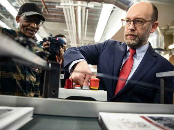 WASHINGTON, DC - FEBRUARY 06: Acting Director of the Office of Management and Budget Russ Vought presses the button that starts the machine that will print copies of President Donald Trumps proposed budget for the U.S. Government for the 2021 Fiscal Year are printed at the Government Publishing Office ahead of its release next week on February 6, 2020 in Washington, DC. Once released, the budget will be debated in Congress before it becomes official. (Photo by Samuel Corum/Getty Images) *** Local Caption *** Russ Vought
