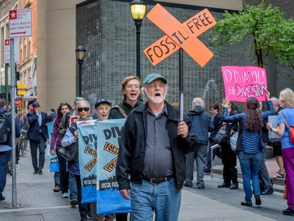 OFFICE OF THE NEW YORK STATE COMPTROLLER, NEW YORK, UNITED STATES - 2018/05/14: Fossil Free Divest NY, in coordination with community members and dozens of groups across America, held a rally outside the office of the New York State Comptroller in New York City, on May 14, 2018, to press NY State Comptroller Tom DiNapoli divest the state pension fund from its $6 billion in fossil fuel holdings, including $1 billion in ExxonMobil. (Photo by Erik McGregor/LightRocket via Getty Images)