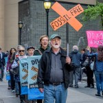 OFFICE OF THE NEW YORK STATE COMPTROLLER, NEW YORK, UNITED STATES - 2018/05/14: Fossil Free Divest NY, in coordination with community members and dozens of groups across America, held a rally outside the office of the New York State Comptroller in New York City, on May 14, 2018, to press NY State Comptroller Tom DiNapoli divest the state pension fund from its $6 billion in fossil fuel holdings, including $1 billion in ExxonMobil. (Photo by Erik McGregor/LightRocket via Getty Images)
