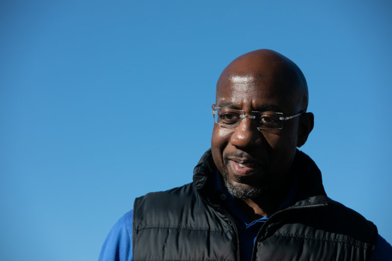 CONYERS, GA - DECEMBER 05: Democratic U.S. Senate candidate Raphael Warnock during an outdoor drive-in rally on December 5, 2020 in Conyers, Georgia. Warnock faces Republican candidate Sen. Kelly Loeffler (R-GA) in a runoff election that will take place January 5th.  (Photo by Jessica McGowan/Getty Images)