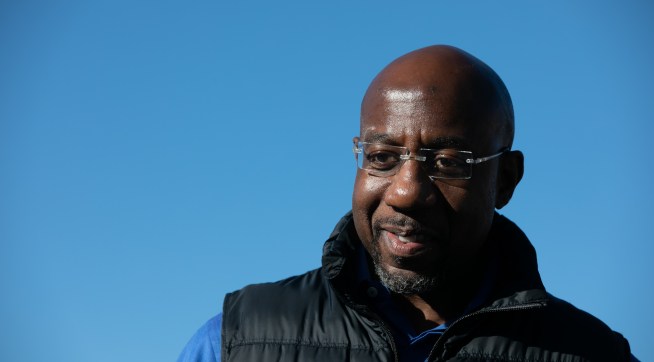 CONYERS, GA - DECEMBER 05: Democratic U.S. Senate candidate Raphael Warnock during an outdoor drive-in rally on December 5, 2020 in Conyers, Georgia. Warnock faces Republican candidate Sen. Kelly Loeffler (R-GA) in a runoff election that will take place January 5th.  (Photo by Jessica McGowan/Getty Images)