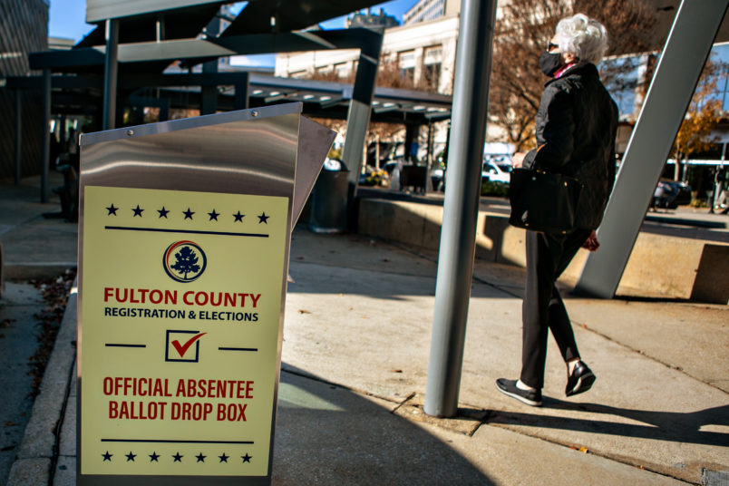 ATLANTA, GA - DECEMBER 14: A voter arrives at the Buckhead library in Atlanta on the first day of In-person early voting for the Georgia Senate runoff election on Monday, Dec. 14, 2020 in Atlanta, GA. (Jason Armond / Los Angeles Times)