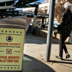 ATLANTA, GA - DECEMBER 14: A voter arrives at the Buckhead library in Atlanta on the first day of In-person early voting for the Georgia Senate runoff election on Monday, Dec. 14, 2020 in Atlanta, GA. (Jason Armond / Los Angeles Times)
