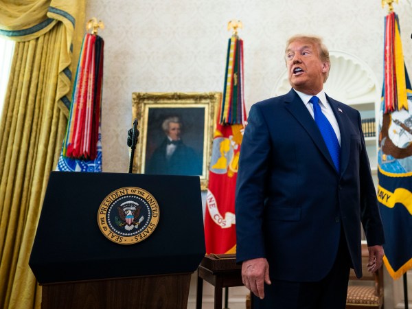 President Donald Trump presents the Presidential Medal of Freedom to Dan Gable in the Oval Office, Monday, Dec, 7, 2020.   ( Photo by Doug Mills/The New York Times)