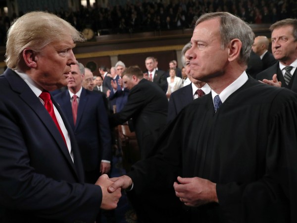 U.S. President Donald Trump greets Supreme Court Chief Justice John Roberts as he arrives to deliver his State of the Union address to a joint session of the U.S. Congress in the House Chamber of the U.S. Capitol in Washington, U.S. February 4, 2020. REUTERS/Leah Millis/POOL