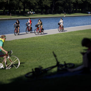 WASHINGTON, D.C., Aug. 31, 2020 -- People ride bicycles on the National Mall in Washington, D.C., the United States, Aug. 30, 2020. The number of COVID-19 cases in the United States reached 5,994,855 as of 9:28 p.m. EDT on Sunday, according to the Center for Systems Science and Engineering at Johns Hopkins University. (Photo by Ting Shen/Xinhua via Getty)