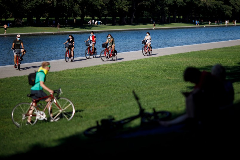 WASHINGTON, D.C., Aug. 31, 2020 -- People ride bicycles on the National Mall in Washington, D.C., the United States, Aug. 30, 2020. The number of COVID-19 cases in the United States reached 5,994,855 as of 9:28 p.m. EDT on Sunday, according to the Center for Systems Science and Engineering at Johns Hopkins University. (Photo by Ting Shen/Xinhua via Getty)