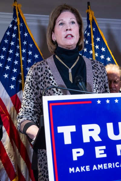 UNITED STATES - NOVEMBER 19: Sidney Powell, attorney for President Donald Trump, conducts a news conference at the Republican National Committee on lawsuits regarding the outcome of the 2020 presidential election on Thursday, November 19, 2020. Trump attorney Rudolph Giuliani, left, also attended. (Photo By Tom Williams/CQ Roll Call)
